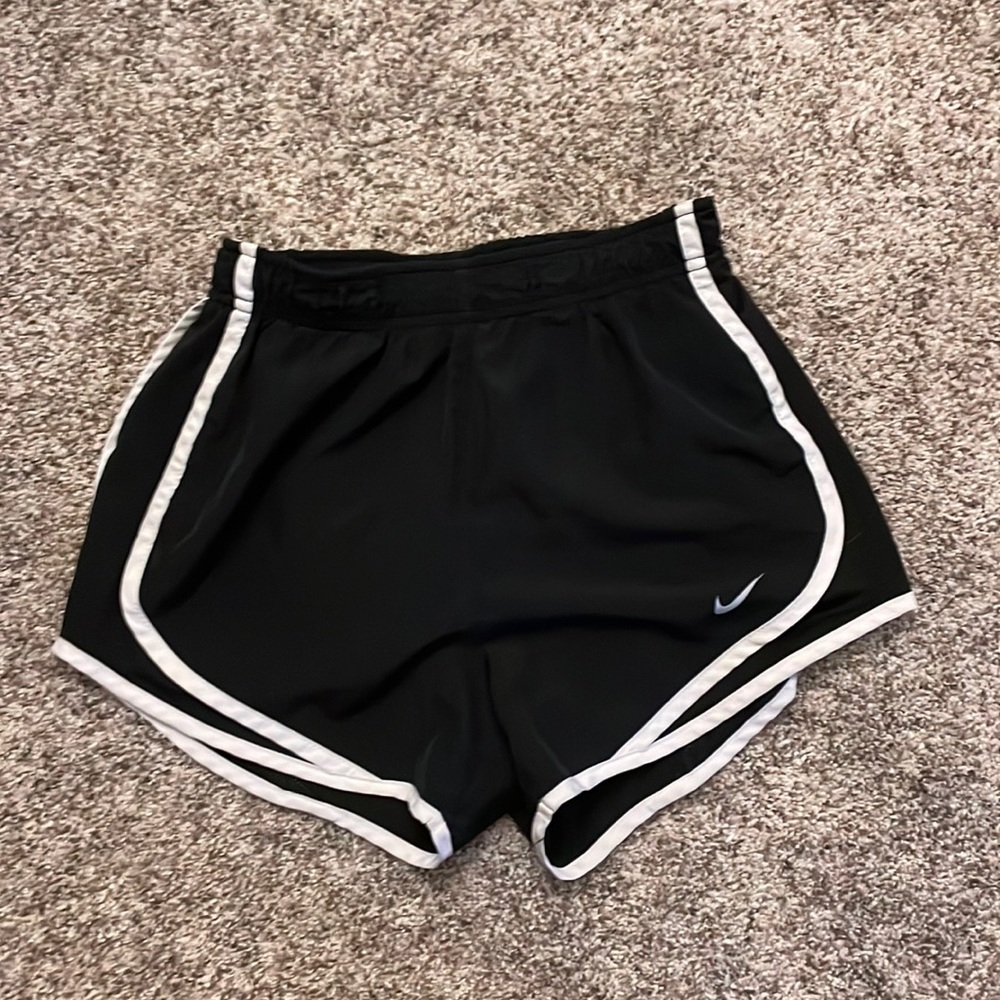 Black Nike running shorts.